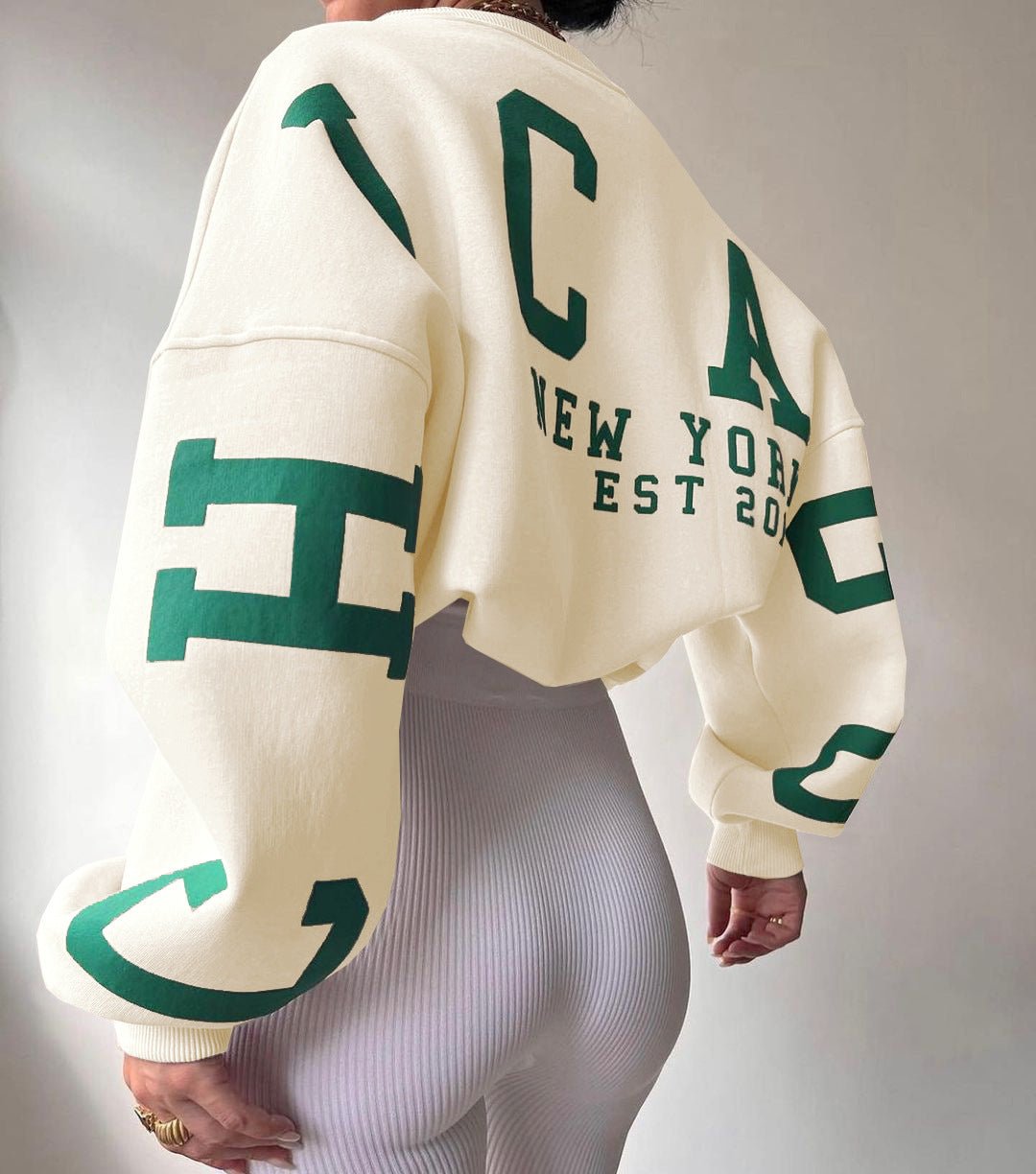 Damska bluza oversize z okrągłym dekoltem ocieplana polarem z rękawami w stylu varsity