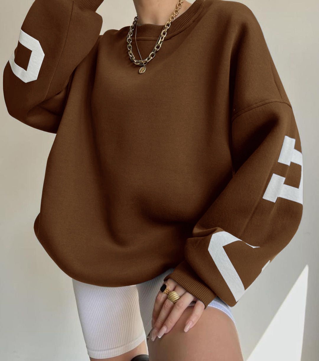 Damska bluza oversize z okrągłym dekoltem ocieplana polarem z rękawami w stylu varsity