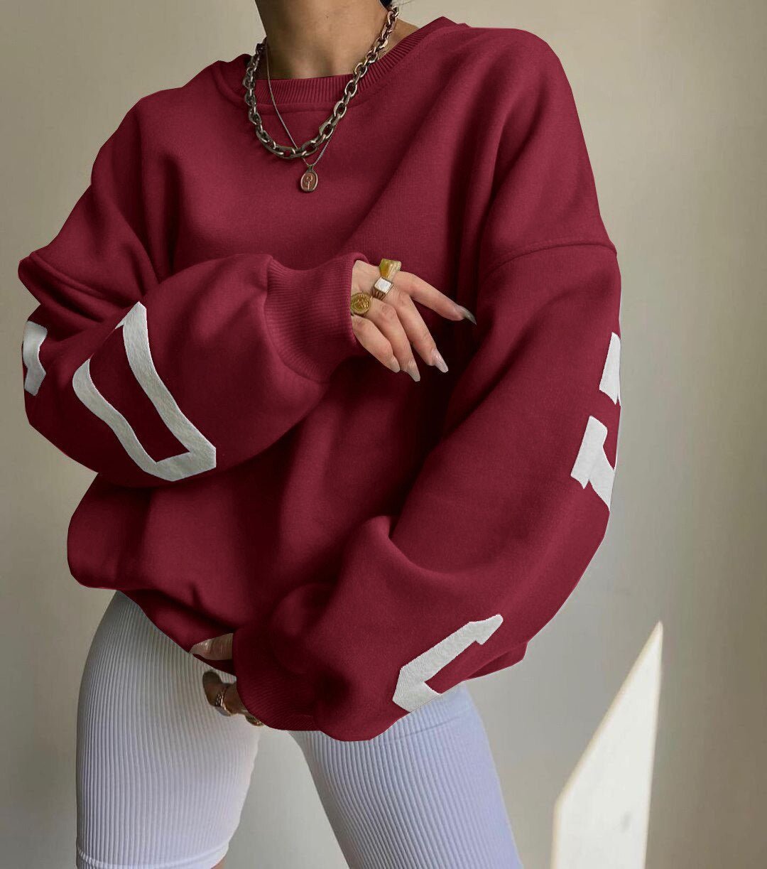 Damska bluza oversize z okrągłym dekoltem ocieplana polarem z rękawami w stylu varsity