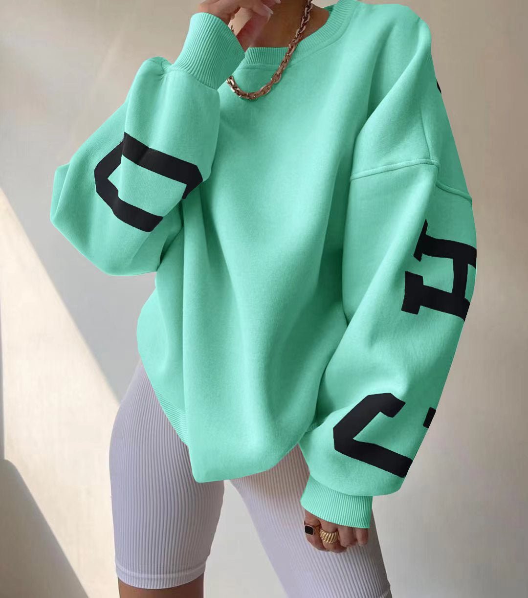 Damska bluza oversize z okrągłym dekoltem ocieplana polarem z rękawami w stylu varsity